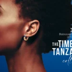 African model with short hair wearing an earring from Bernhard H. Mayer Timeless Tanzanite Collection of QNET Jewellery